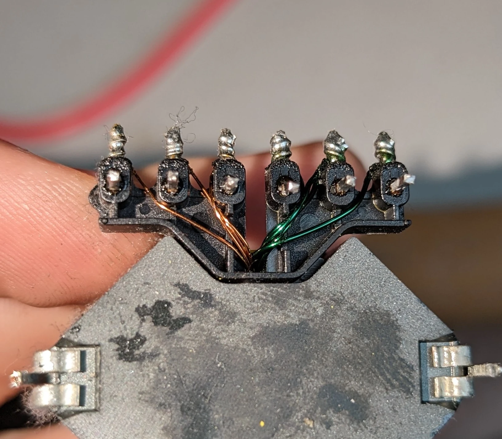 The transformer upside-down: showing burnt wires on the right side